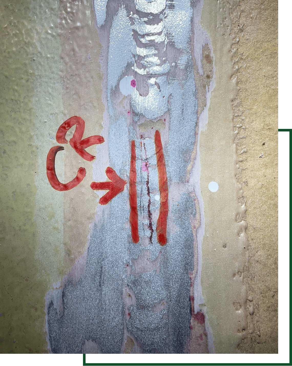 Exposed layers showing red arrow and lines.